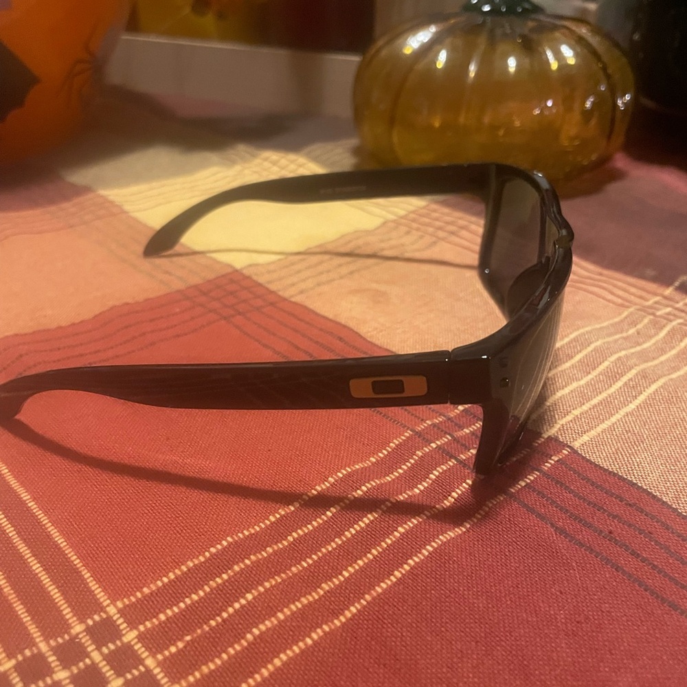 Oakley Holbrook Collection. Black/Gold frames with polarized lenses.